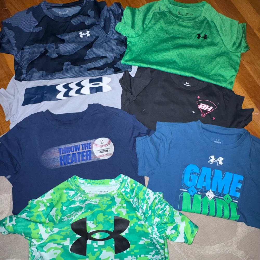 7 YM UA tees
The 2 green and blue camo: performance type fabric, rest are cotton